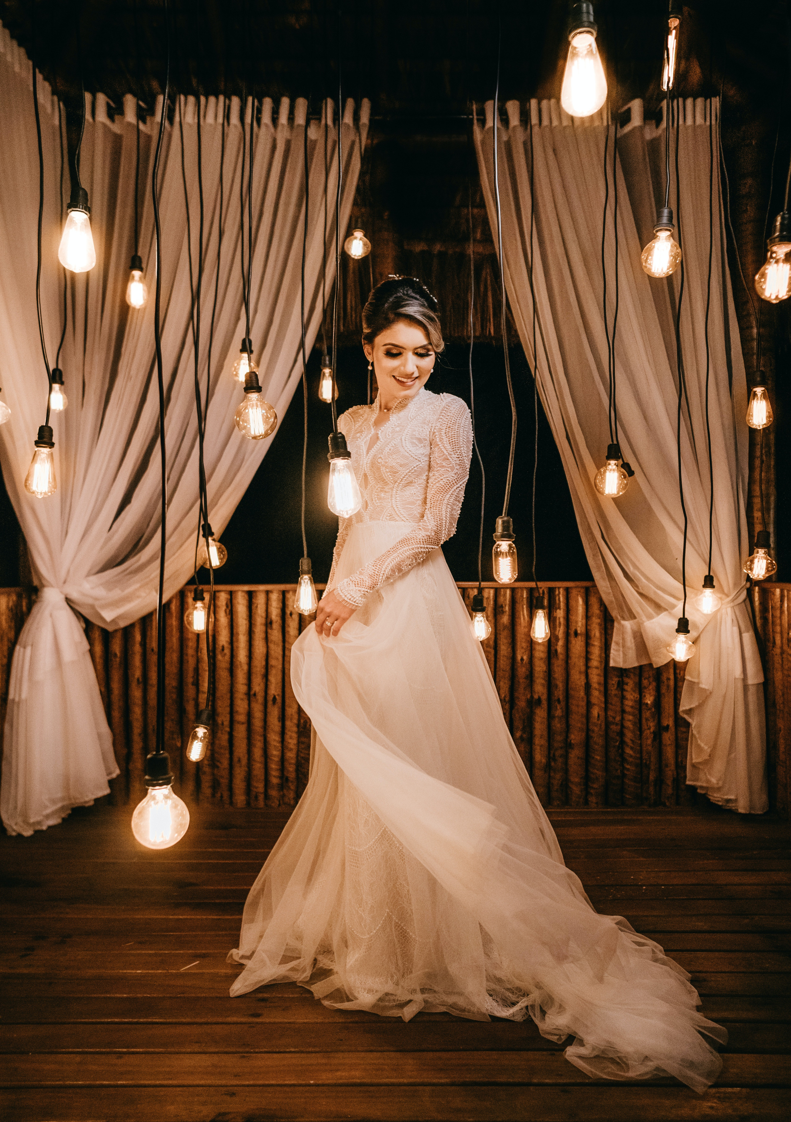 Wedding Dress with Hanging Lights in the Background